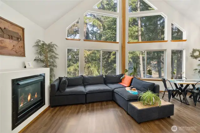 Granite surround on the fireplace, beautiful flooring and vaulted ceilings, you will want for nothing more to complete this space!