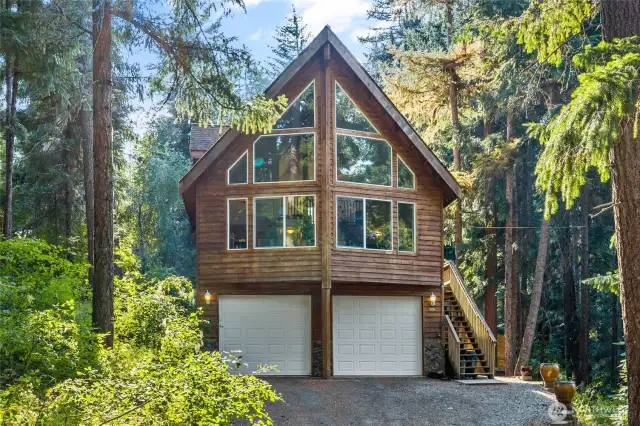Beautiful cedar sided home with 2 bedrooms, 2 full baths, large loft which could be another bedroom, large bonus room downstairs in addition to a 2-car garage.