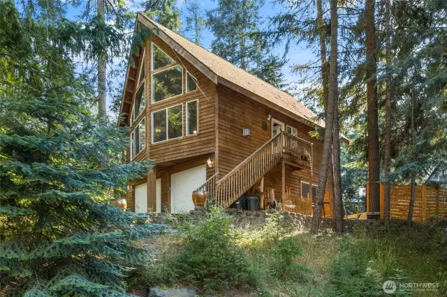 Nestled within the woods with floor to ceiling windows to the let the all the natural light in.