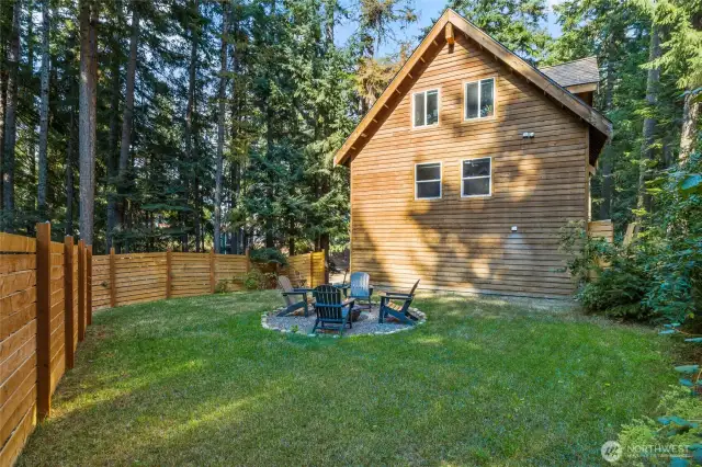 This backyard is a quiet space to be enjoyed!  Horizontal slat fencing works not only as a privacy tool but is also visually appealing.