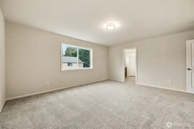Primary Bedroom-Disclaimer:  Photos are from another Rose floor plan in previous community, finishes, upgrades, and features will vary.
