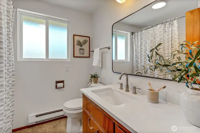 Second bathroom with marble counters, new sink, lighting and mirrow.