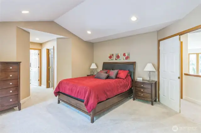 The main suite features double doors in, peaked ceilings, TWO walk-in closets and a 5-piece bath.  Perfect!