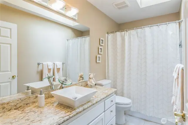 The main bath serving the three guest rooms upstairs.