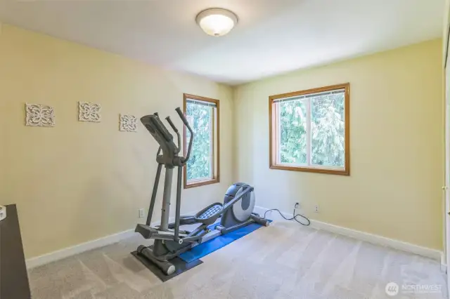 The third guest room on the upper level.  Here being used for exercise equipment.