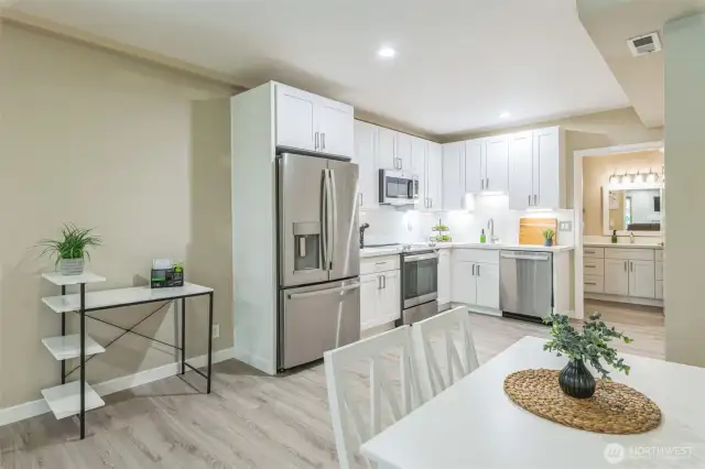 Downstairs is the true bonus space!  Imagine having a completely separate space for multi-generational living or as an income producing rental.  All new - flooring, cabinets, appliances, dining set.  Everything is included in the sale....right down to the flatware and dishes.