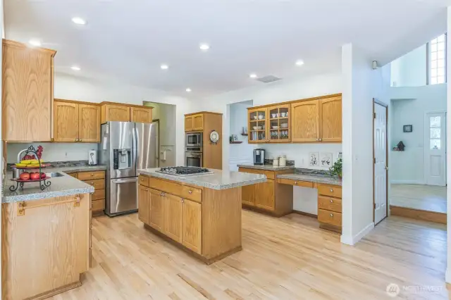 Unique granite counters and sturdy oak cabinets make a beautiful and functional kitchen.