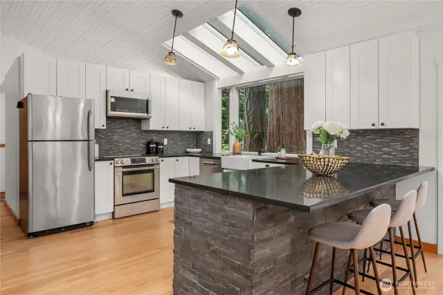 Great open kitchen with quartz countertops and farm sink.