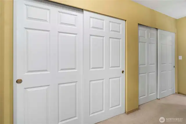 Two sets of closets as you enter primary suite