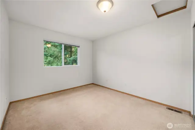 One of two additional bedrooms on upper level