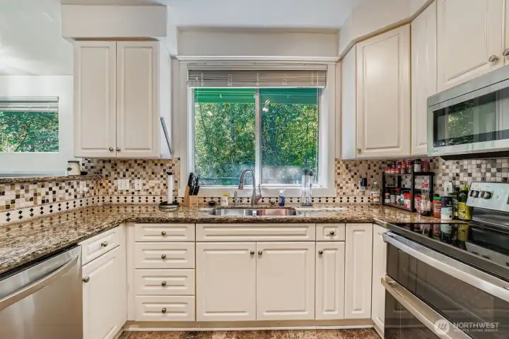 Stainless steel appliances shine in the updated kitchen.