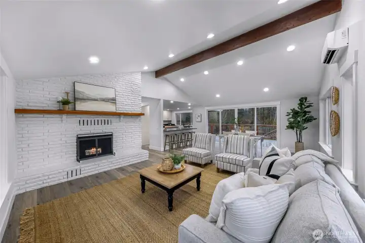 Original brick fireplace surrounding for added depth to your ultra cozy living space