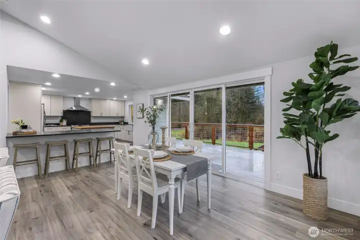 Double wide sliding glass door opens to large deck perfect for entertaining