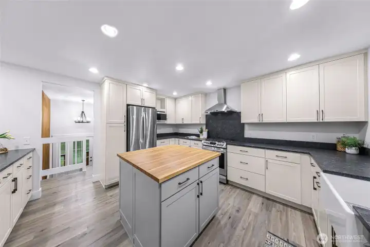 Large open kitchen, plenty of space for all your cooking and entertaining needs! Beautiful butch block accent island with storage. All new stainless steel appliances and gas range!