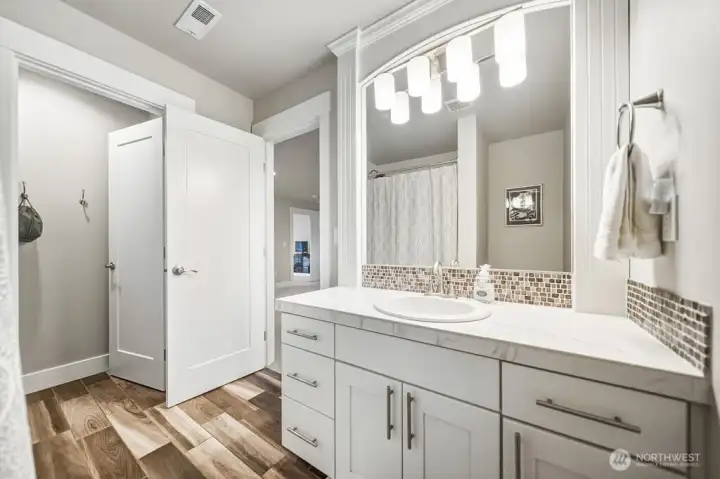 Guest bathroom. Beautiful tile flooring.