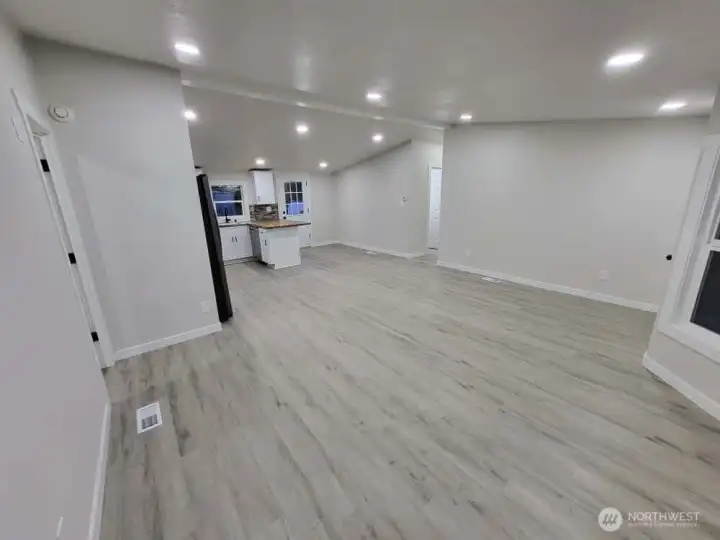 We are heading back out into the main living area -- we came from the doorway on the left side of the photo. Heading across to the bright hallway