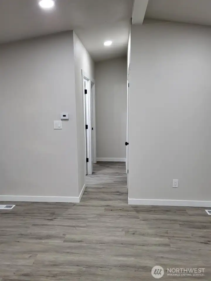 Bright hallway we are about to enter; featuring bedrooms #2 & #3, and 2nd bath, which is a 3/4 bath w/ shower