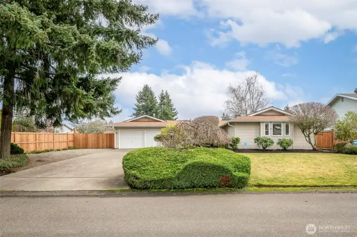 Sprawling rambler on over 11,000 sq ft lot. RV or boat parking and oversized 2 car garage.