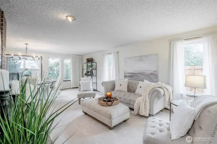 Spacious living/dining room with cozy fireplace.