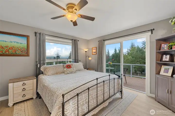 Primary Bedroom with deck off slider. Views of sound and Mount Baker!
