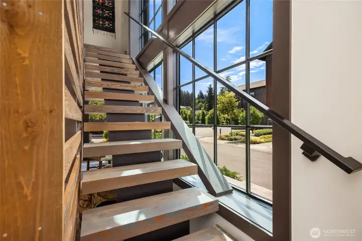 Floating steps against the three story south facing window wall. Light light light!