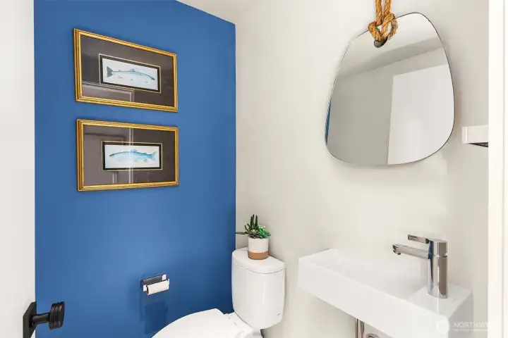 Half bath tucked away for guests