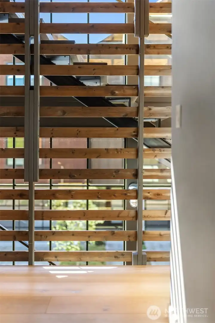 Industrial design that is warm with raw wood and rich tones.