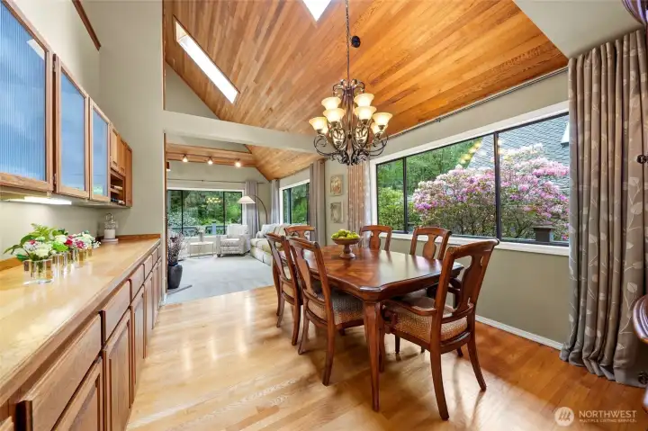 The dining room has a built-in buffet, wall to wall windows and skylights.