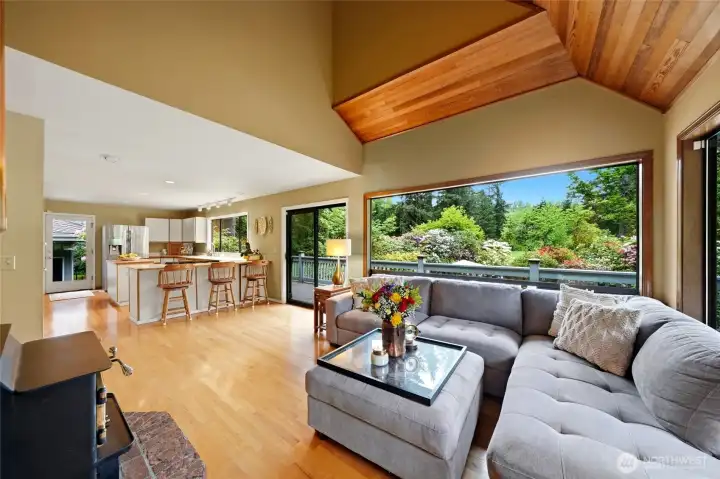 Windows fill this room with natural light and beautiful garden views. The sliding door leads to the wrap around deck and backyard.