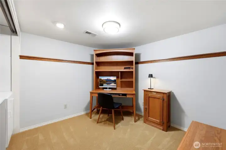 The office is downstairs adjacent to the bonus room.