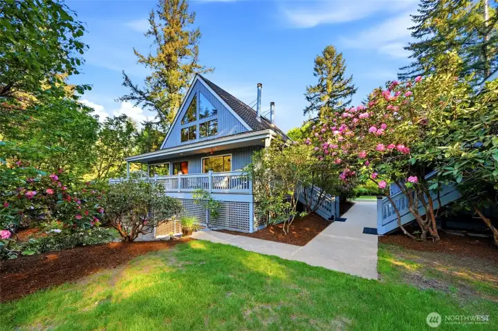 The wrap around deck on the house easily leads to the detached garage and the 520 sf studio apartment above the garage.