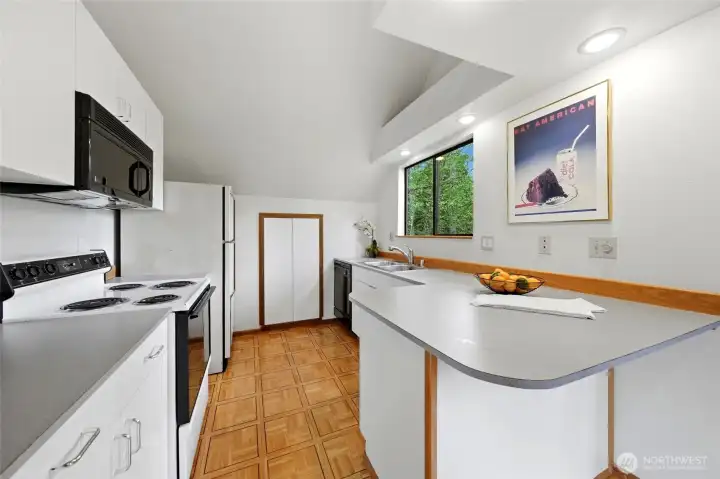 The DADU has a full size refrigerator, dishwasher and electric range.