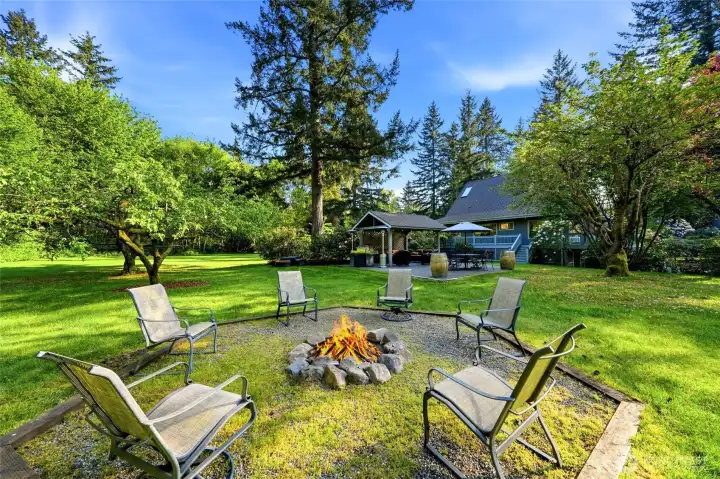 This property is meant to be enjoyed. The covered patio and fire pit are easily accessed from the house.