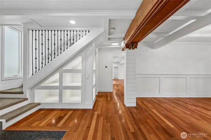 Staircase Embraced With Lit  Display Cases. Stunning.