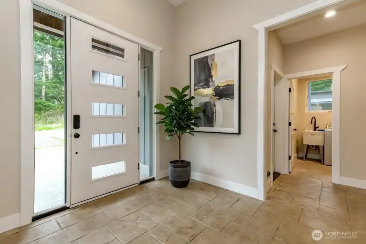 Grand entry with soaring ceiling and 5 light door
