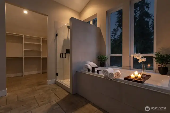 The Primary suite bathroom is your own spa soaker tub