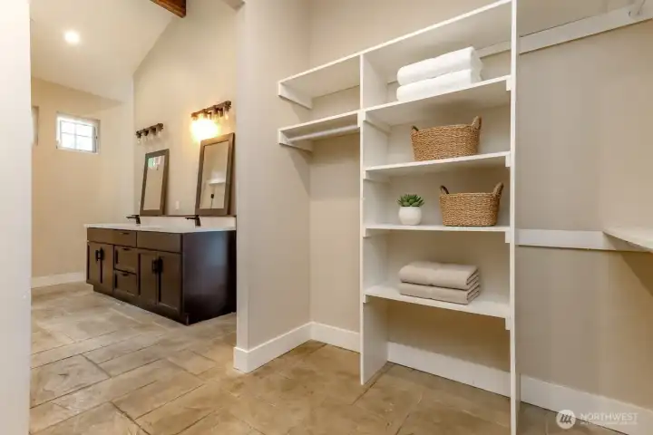 The Primary suite walk-in closet with built-in organizers