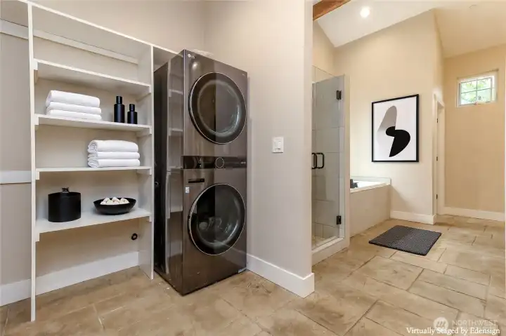 The Primary suite walk-in closet has it's own washer and dryer.