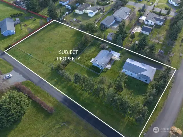 Mature trees, fenced yard, and pasture on this 1.41 acre corner lot.