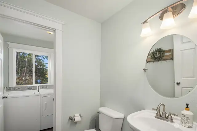 Main floor half bath with access to the laundry room.