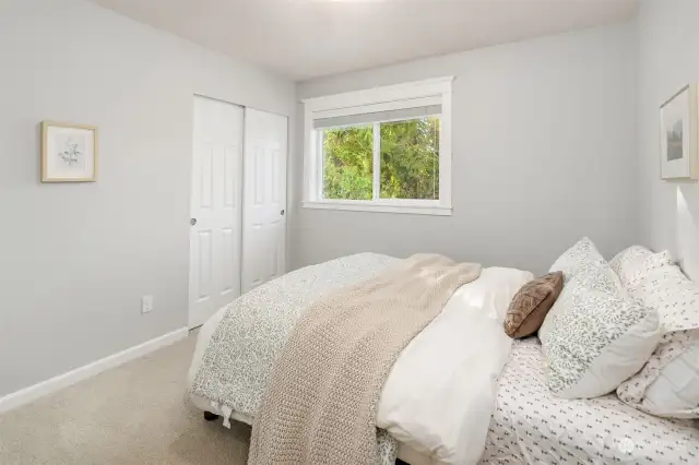 Additional bedroom with wooded views.