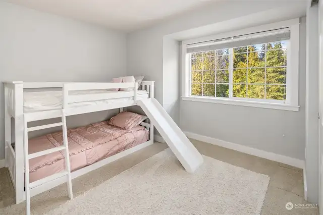 Additional bedroom with wooded views.