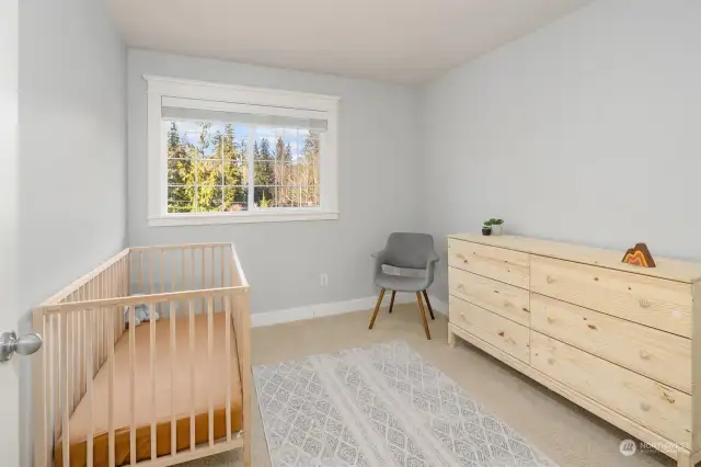 Additional bedroom with wooded views.