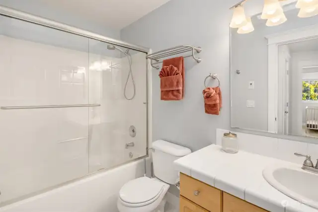 Full bath with tub/shower combo.