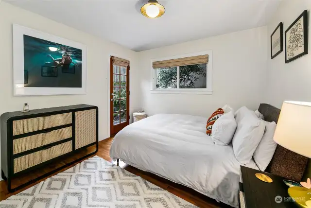 The main bedroom is in the southeast corner of the house and looks out to one of several gardens.