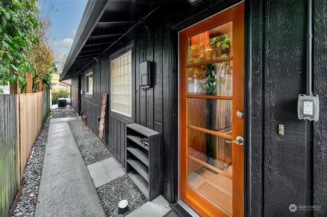 This is a shot of the north side of the house and includes a photo of the kitchen door.