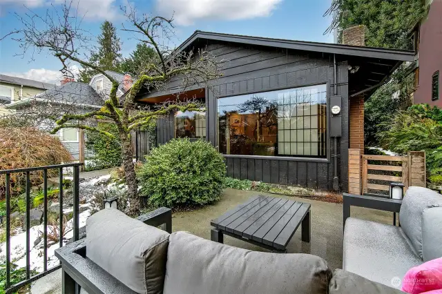 Enjoy afternoons with south and west exposure. This patio sits above the one car garage.