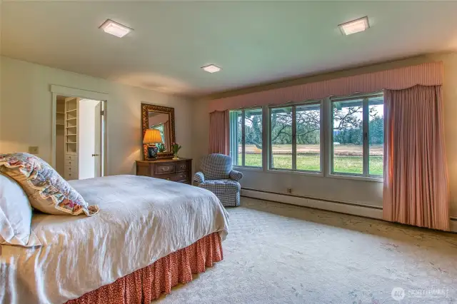 Pond views from the primary suite take in the avian wildlife and morning light.