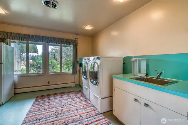 The laundry room is large enough if one wanted to turn it into a fourth bedroom. Now it is used as a large utility and storage pantry room.