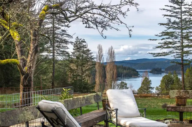 The deck overlooks a sublime view of Pole Pass overlooking the Wasp Islands. Quintessential Deer Harbor "gold coast" views.